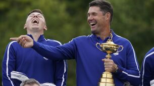 <p>Team Europe captain Padraig Harrington and Matt Fitzpatrick smile as they pose for a team picture during a practice day at the Ryder Cup. Picture: Charlie Neibergall</p>