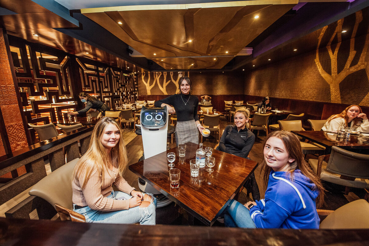  Kristina Skurauskaite serves Nicola Burke, Nicole Lammond and Jade Walsh with Bella.