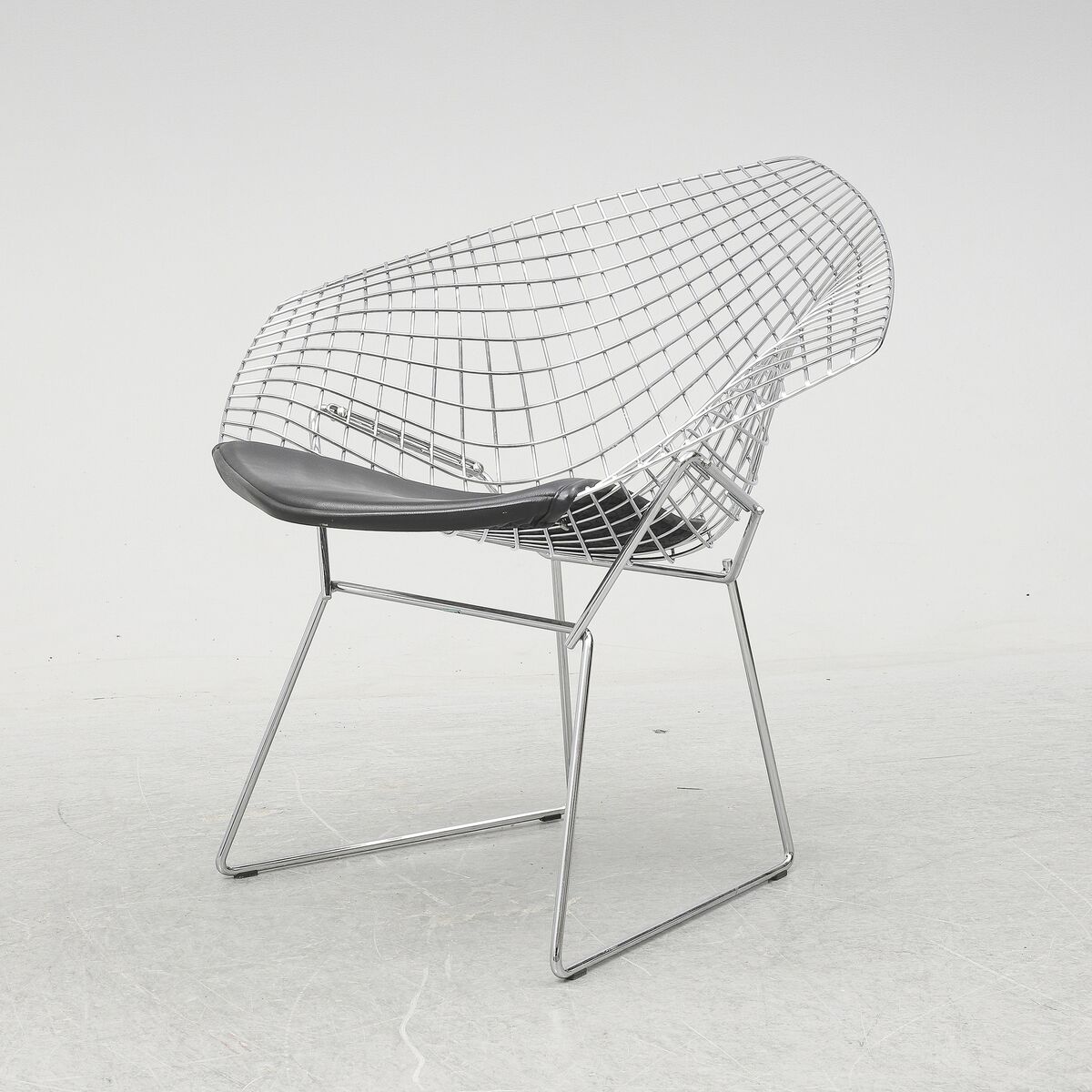 The Diamond armchair by Harry Bertoia in polished chrome over steel c.1952, €1,519 new. Vintage suppliers include Bukowskis and Panomo.