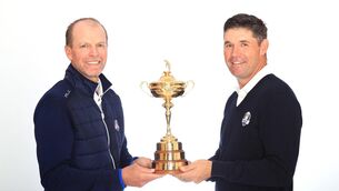 <p>United States captain Steve Stricker and European counterpart Padraig Harrington pose with the Ryder Cup. Picture: Andrew Redington, Getty Images</p>