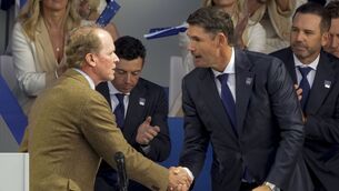 <p>Team USA captain Steve Stricker shakes hands with Team Europe captain Padraig Harrington during the opening ceremony for the Ryder Cup at Whistling Straits. Picture: AP Photo/Charlie Neibergall</p>