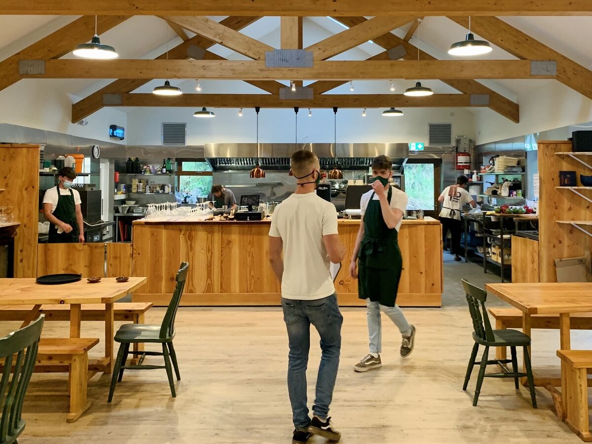 The main dining room and open kitchen at Camus Farm Field Kitchen