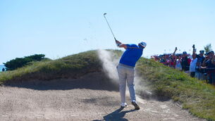 <p>Shane Lowry of Team Europe chips from a bunker during his Friday afternoon fourballs match with Rory McIlroy against Tony Finau and Harris English. Picutre: Tom Russo/Sportsfile</p>