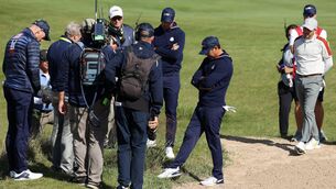 <p>KOHLER, WISCONSIN - SEPTEMBER 25: A rules lawyer inspects the lie of a ball for Daniel Berger of team United States and Brooks Koepka of team United States on the 15th hole during Saturday Morning Foursome Matches of the 43rd Ryder Cup at Whistling Straits on September 25, 2021 in Kohler, Wisconsin. (Photo by Warren Little/Getty Images)</p>