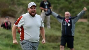 <p>THAT'S MY BOY: Shane Lowry, with his father Brendan in the background, celebrates making a clutch 12ft putt to claim a 1 up victory with Tyrell Hatton over Harris English Tony Finau. Pic: Warren Little, Getty Images)</p>