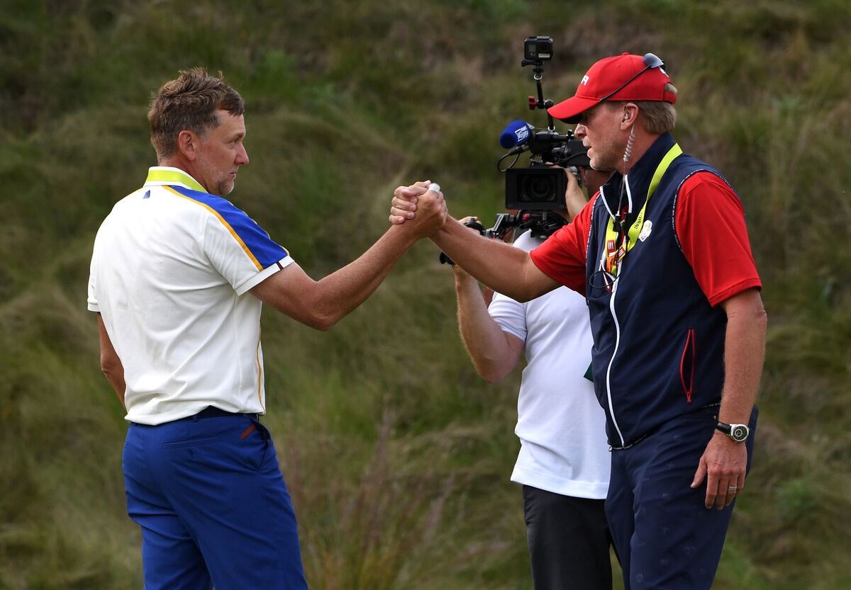 Ian Poulter shakes hands with Steve Stricker