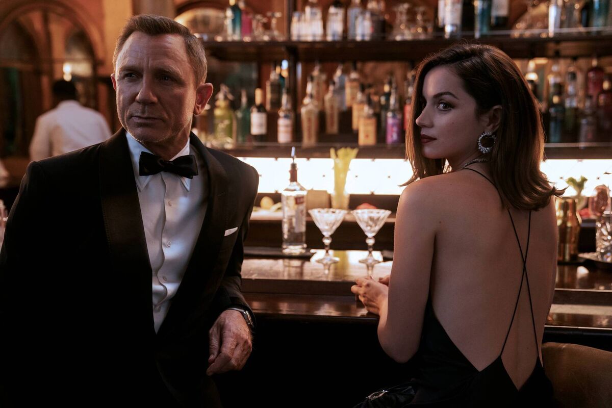 Daniel Craig as Bond and Ana de Armas as Paloma