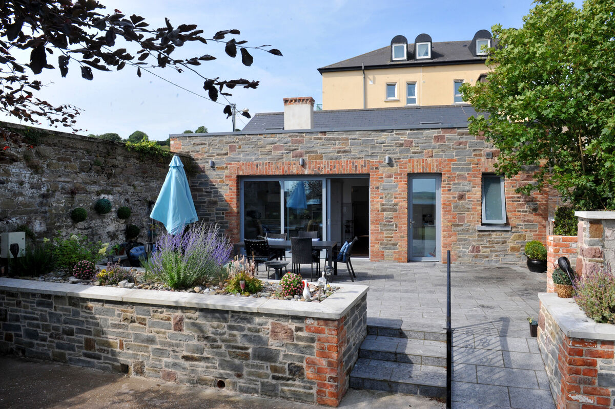 The rear garden and patio/courtyard. 