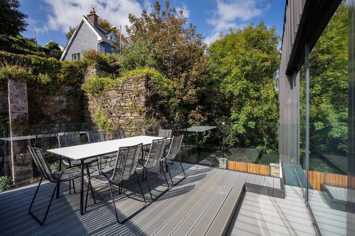 The first-floor back outdoor living/dining space. 