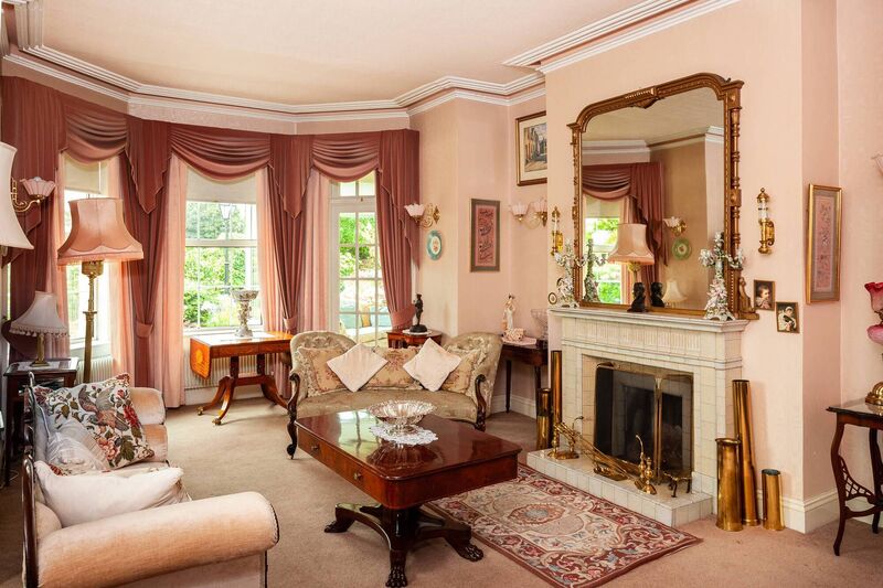 One of the reception rooms with mid C20th fireplace