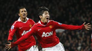 Ji-Sung Park (right) has appealed to Manchester United fans to stop a song which contains a racial stereotype about his native South Korea (Dave Thompson/PA)