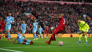 <p>Manchester City's Rodri blocks a late shot into an open goal from Liverpool's Fabinho at Anfield. Picture: Peter Byrne/PA</p>