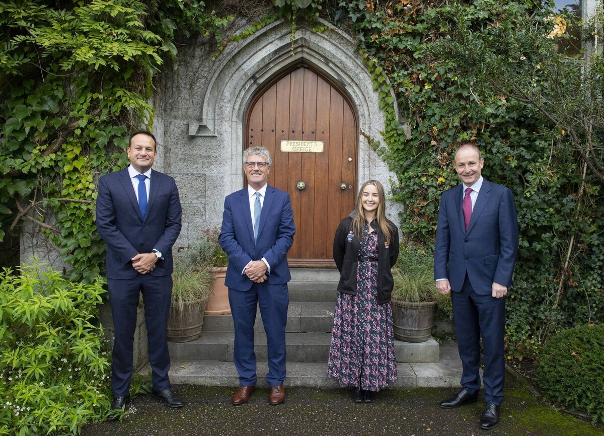 (Left to right) Tánaiste Leo Varadkar, Professor John O'Halloran President of UCC, Alicia O'Sullivan second-year Law Student at UCC and Taoiseach Micheál Martin at UCC today. Photo: Julien Behal