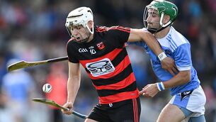 <p>Ballygunner's Dessie Hutchinson is tackled by Dale Hayes of Roanmore at Walsh Park. Photo by Piaras Ó Mídheach/Sportsfile</p>