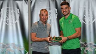 <p>John Egan being presented with an Ireland cap by Denis Irwin. Pic via @JohnEgan92 Twitter</p>
