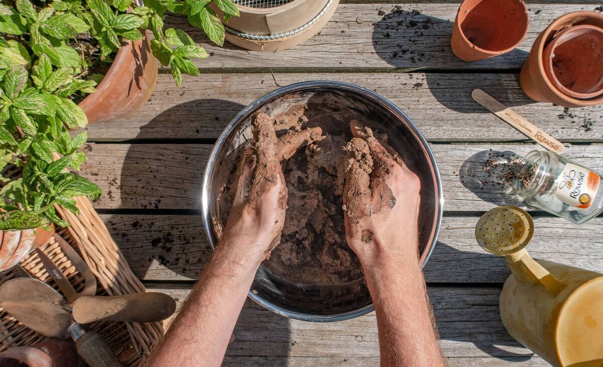 Seed bomb ingredients being mixed. Picture: Rowse/PA