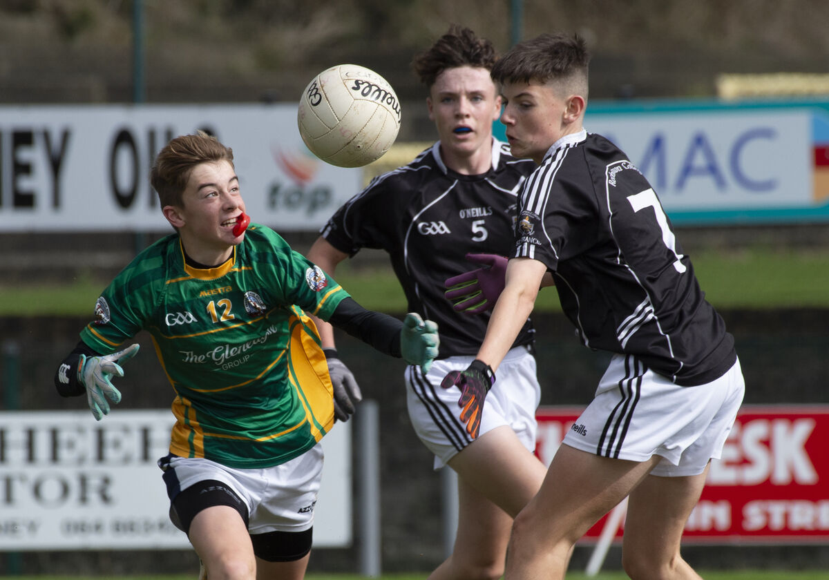  Oisín Fleming, St Brendan's fighting for this ball with Rochestown College players Cathal Lowney and Keelan Kavanagh. Picture: Dan Linehan
