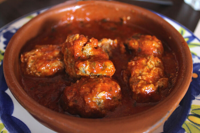 Meatballs in tomato and orange sauce