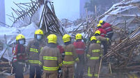 Worker killed and others trapped after scaffolding collapses in Hong Kong