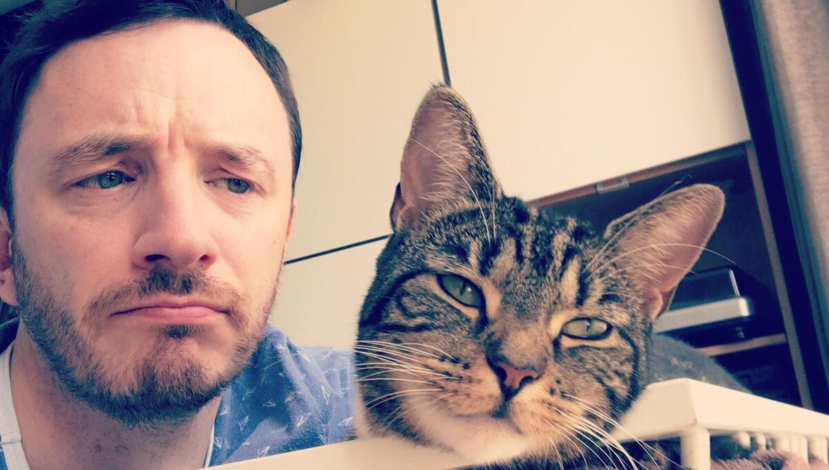 Gearoid Farrelly and his cat Boots Gearoid Farrelly and his cat Boots