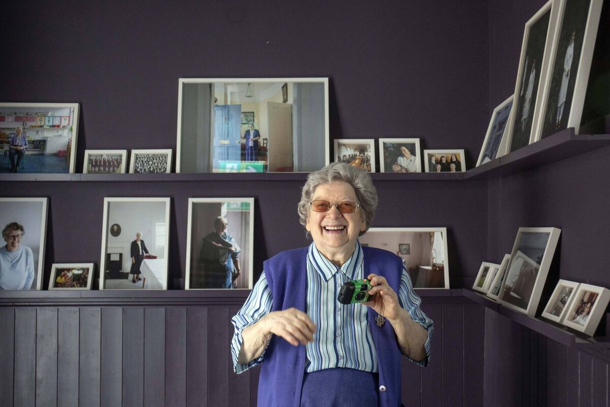 Sister Patricia O’Shea pictured taking a picture at the 'Not to make a noise about it' exhibition. Picture: Clare Keogh 