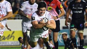 <p>Toulon's French fly-half Anthony Belleau dives to score a try during the French Top 14 rugby union match between Toulon and Brive on October 9, 2021 at the Mayol stadium in Toulon.  Photo by CLEMENT MAHOUDEAU/AFP via Getty Images)</p>