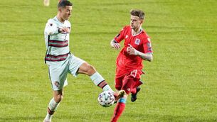 <p>NO MUGS: Luxembourg's Sebastien Thill challenges Cristiano Ronaldo during their World Cup qualifier at Josy Barthel stadium last March</p>