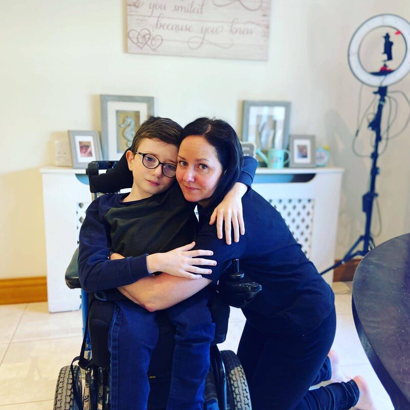 Adam with his mother, Christine, who said she will go to the ends of the earth for her son.