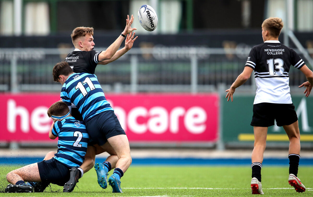 Newbridge College's Jack Dennis is tackled by Max Lavelle and Daire McCarthy of Castleknock College. Picture: INPHO/Evan Treacy Newbridge College's Jack Dennis is tackled by Max Lavelle and Daire McCarthy of Castleknock College. Picture: INPHO/Evan Treacy