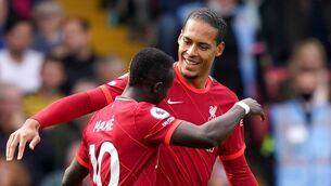 <p>Liverpool's Sadio Mane (left) celebrates scoring their side's first goal of the game with Virgil van Dijk during the Premier League match at Vicarage Road, Watford. Picture: Tess Derry/PA</p>