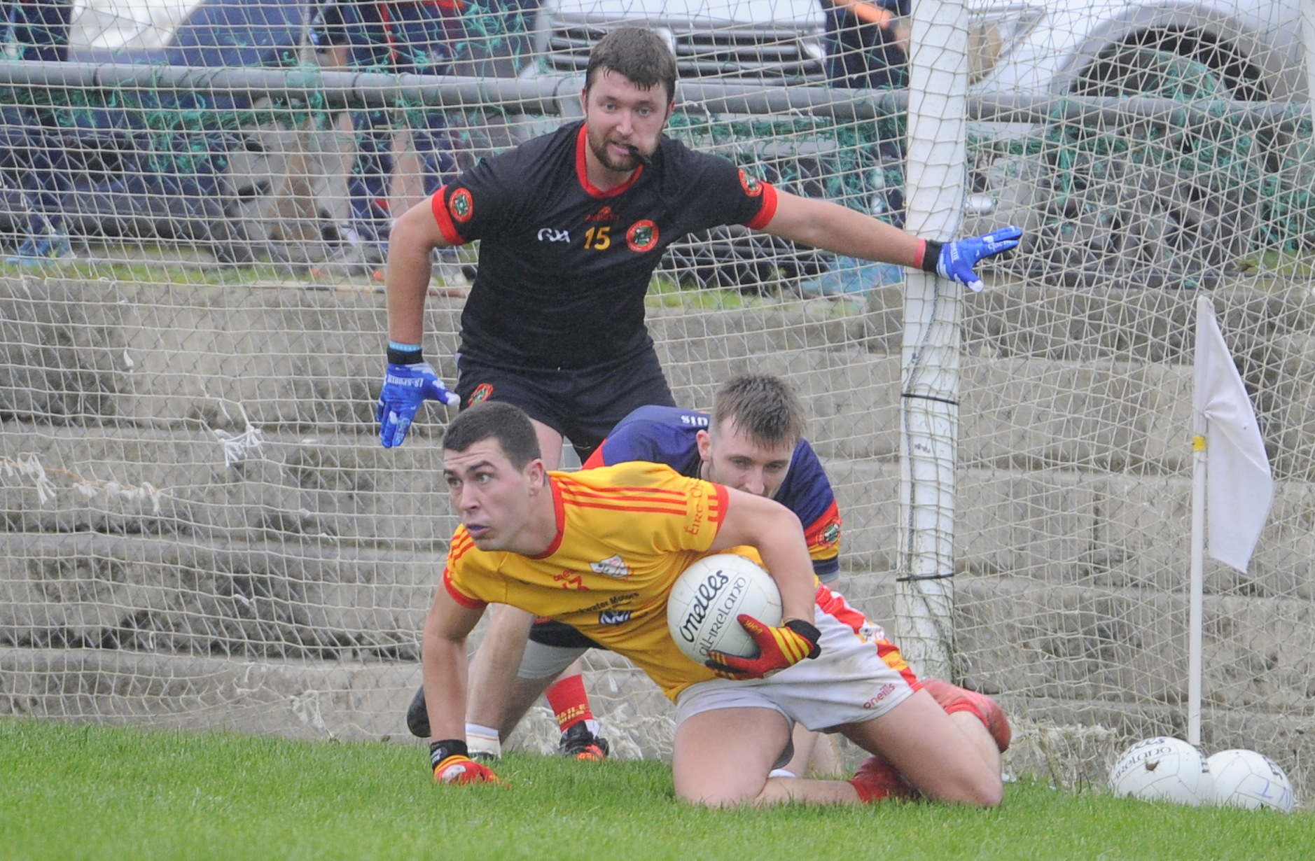 Éire Óg's Dylan Foley keeps control of the ball before scoring a goal against Newcestown's, James Kelleher and keeper Cathal Clarke in the Cork PSFC at Kilmurray GAA grounds. Pic: Gavin Browne