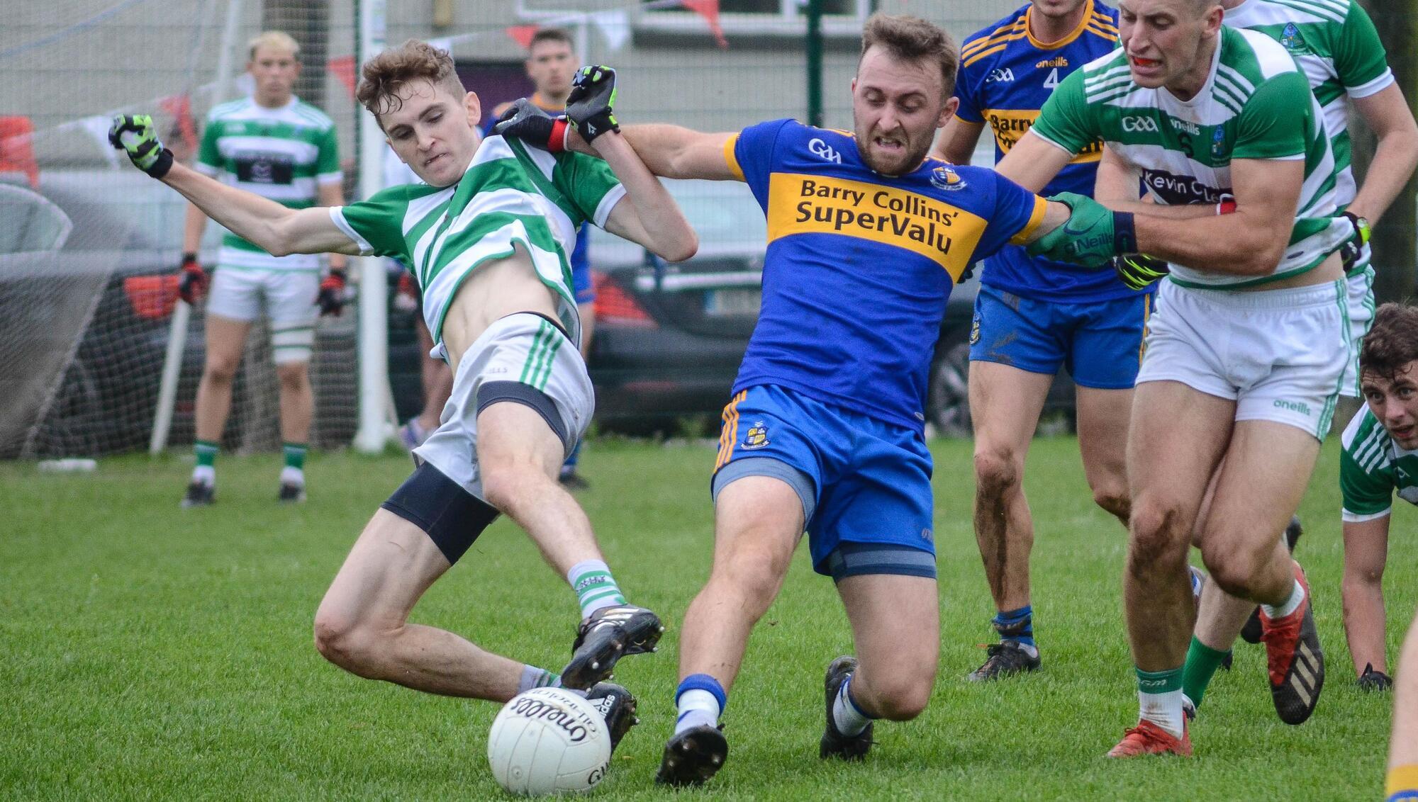 Valley Rovers' Rory O'Sullivan and Carrigaline's David Drake battle for possession during the Cork Premier SFC R3 tie h in Ballinhassig. 