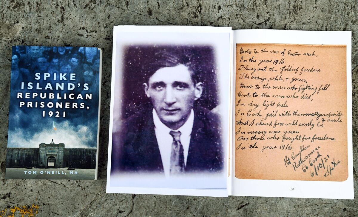 Tom O'Neill's book, 'Spike Island's Republican Prisoners 1921', and a photograph of Damien Coughlan great grandfather, Pat Coughlan, and the page in Patrick Tobin's autograph book from Spike in 1921 featuring an autographed poem written by Pat. Picture: Denis Minihane