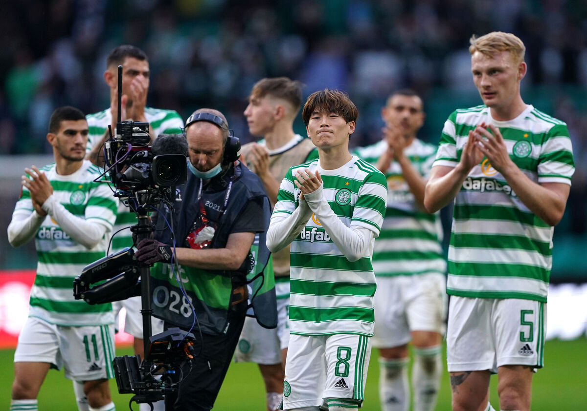 Celtic players applaud the fans after the final whistle. Picture: Andrew Milligan/PA 