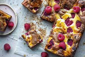 Perfect fudgy dark and white ripple brownies with raspberries