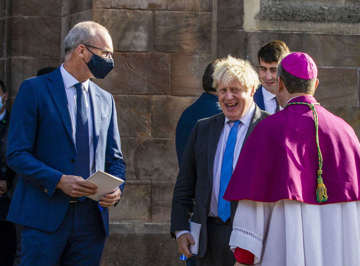 Foreign affairs minister Simon Coveney, British prime minister Boris Johnson, and Archbishop Eamon Martin. Picture: Liam McBurney/PA Wire