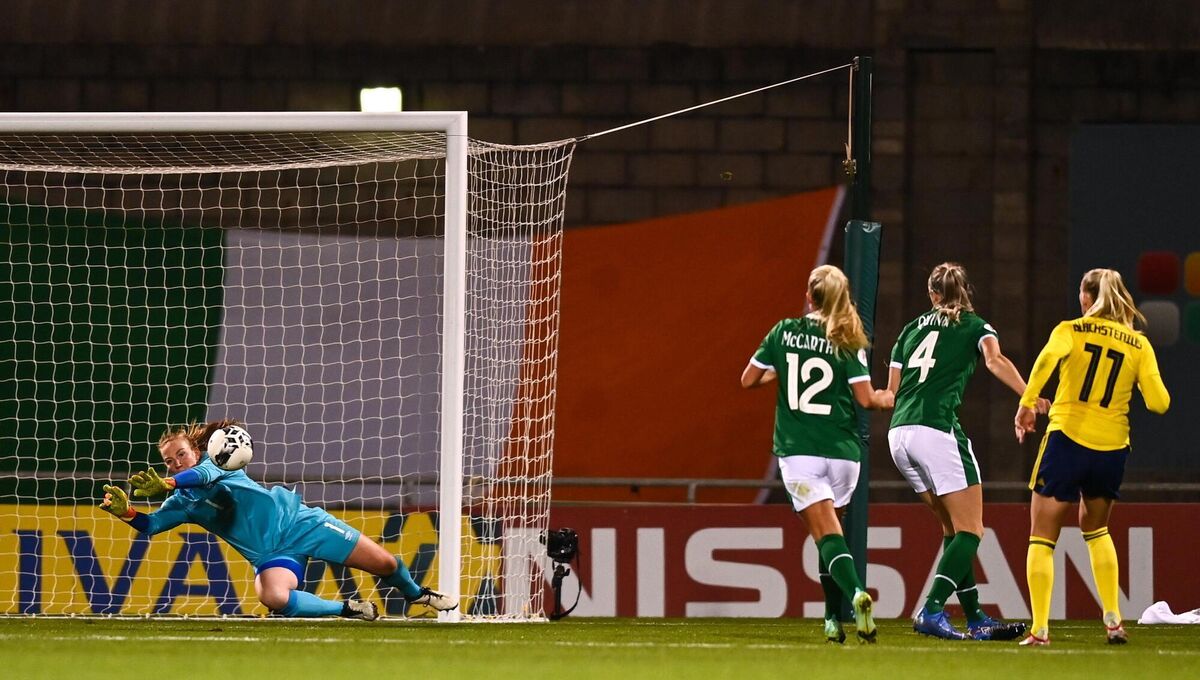 Republic of Ireland goalkeeper Courtney Brosnan saves a shot from Stina Blackstenius