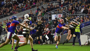 <p> Pa White, Midleton getting in his shot on goal despite the tackle by Sean Kelly, Erin's Own. Picture Dan Linehan</p>
