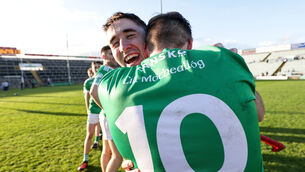 <p>Kilmallock's Micheal Houlihan celebrates after the game with Dan Joy. Picture: INPHO/Laszlo Geczo</p>
