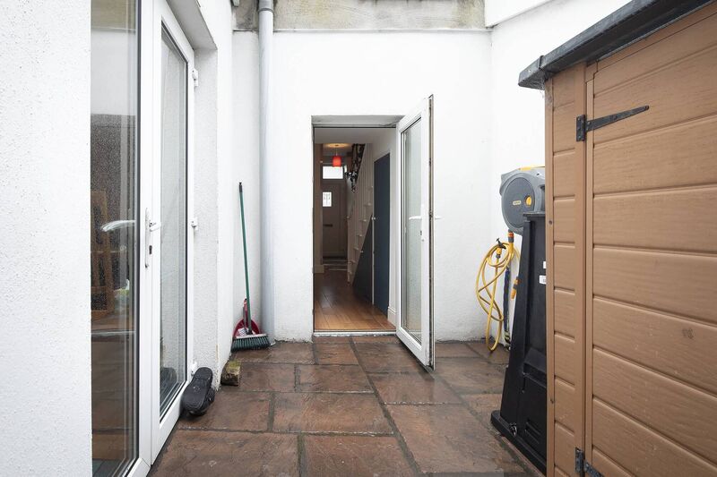 Two access points to the small and tidy yard