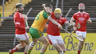 <p>Aaron Fitzgerald, Éire Óg , under pressure from Seamus Foudy, Inagh/Kilnamona, in the CLARE SHC semi-final in Cusack Park, Ennis </p>