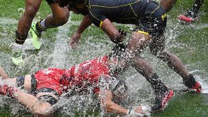<p>Toulon's French centre Theo Dachary (C) falls in the water as Biarritz Olympique's Australian wing Henry Speight (R) attenpts to tackle him during the French Top 14 Rugby union match between Rugby Club Toulonnais (Toulon) and Biarritz Olympique at Stade Mayol in Toulon, south-eastern France, on October 30, 2021. (Photo by Christophe SIMON / AFP) (Photo by CHRISTOPHE SIMON/AFP via Getty Images)</p>
