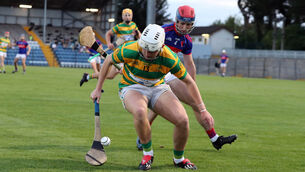 <p> Robbie Cotter, Blackrock tussles for possesion with Alan Moynihan of Erins Own. Picture: Jim Coughlan.</p>