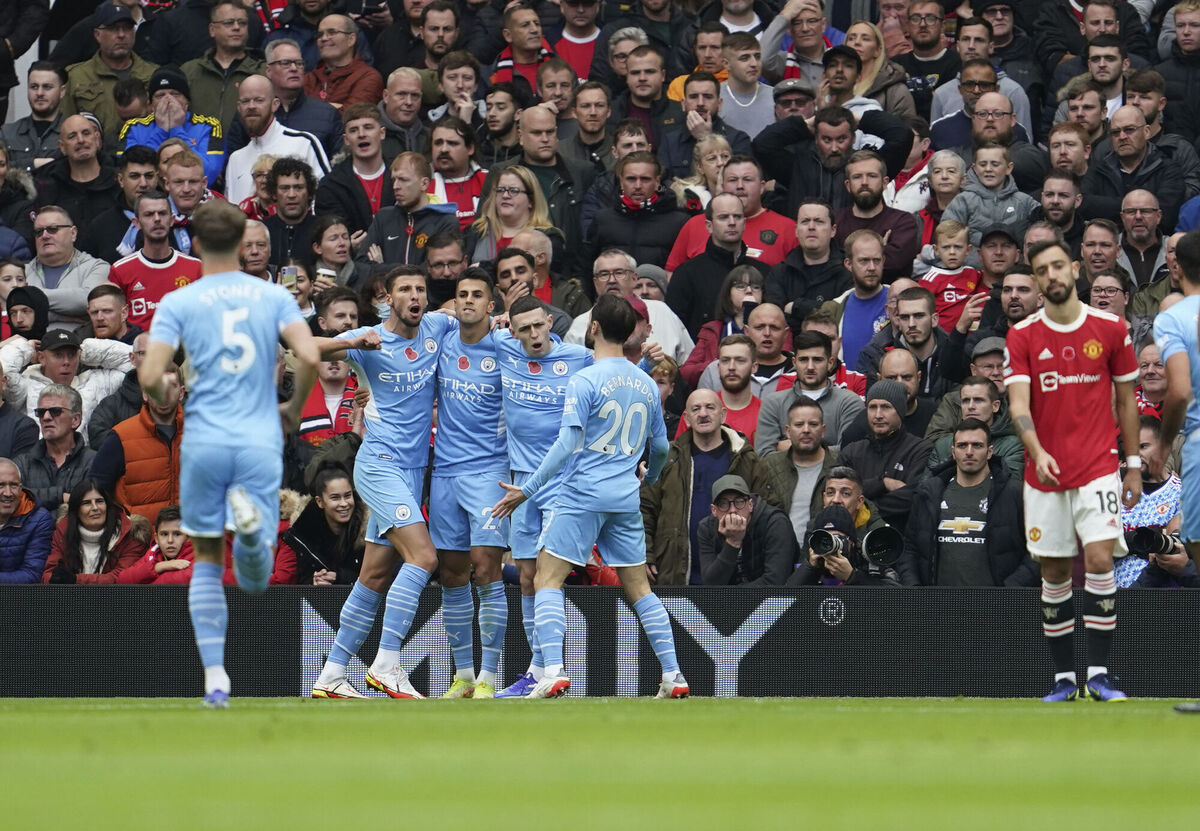 Manchester City players celebrate after United's Eric Bailly scored an own goal. Picture: AP Photo/Jon Super