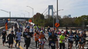 <p>Runners participate in the 2021 TCS New York City Marathon in New York on November 7, 2021. - After a forced break in 2020, the New York City Marathon is back on for its 50th edition, and with it the countless opportunities to run it for charity, an industry that has become a staple, and hopes to take off again after the pandemic. (Photo by ANGELA WEISS / AFP) (Photo by ANGELA WEISS/AFP via Getty Images)</p>