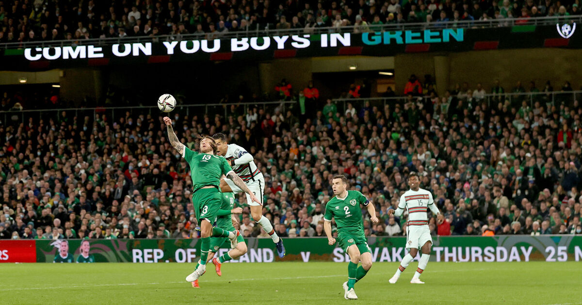 Ireland's Jeff Hendrick and Cristiano Ronaldo of Portugal jump for the ball