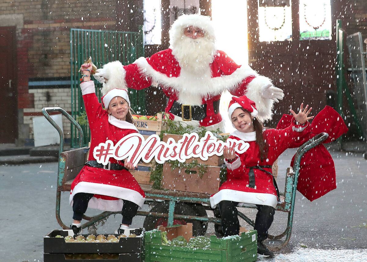 Amelia Breen and Alyssia Breen join Santa at Mistletown.