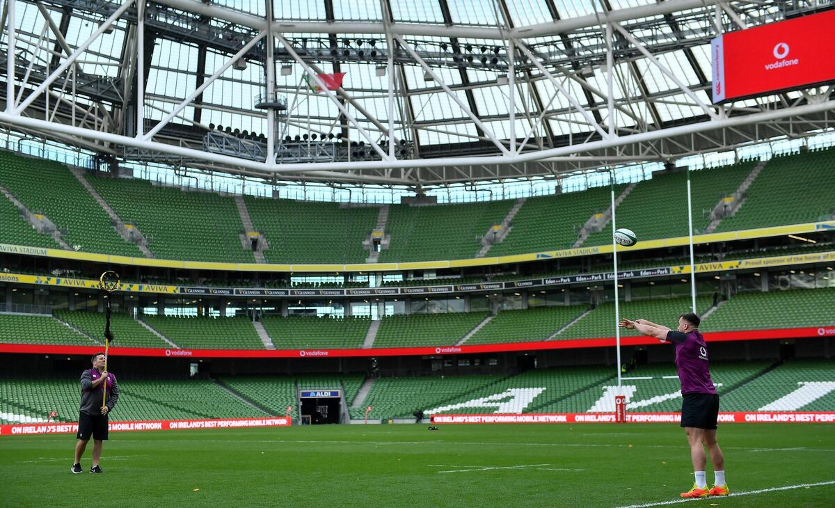Ronán Kelleher with national scrum coach John Fogarty during the Ireland captain's run at the Aviva Stadium on Friday. Photo by Brendan Moran/Sportsfile