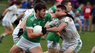 <p>SURGing: Kanturk's Paul Walsh holds off Aghada's Michael Russell during the Bon Secours Cork Premier IFC semi-final at Mourneabbey on Saturday. </p>