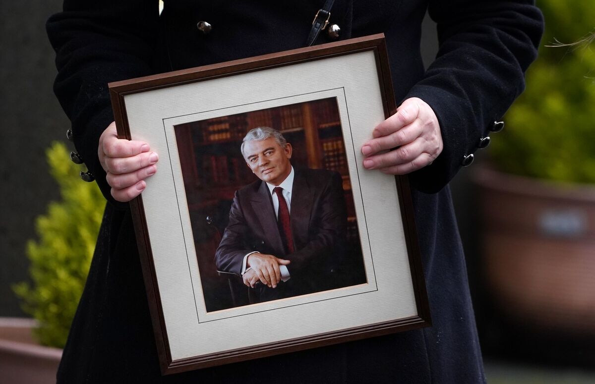 A woman holds a photo of Austin Currie during his Requiem Mass at the Church of the Immaculate Conception in Allenwood, Co Kildare. Picture: PA